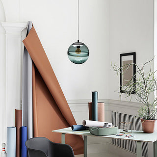Nordic glass ball pendant close-up — stained blue modern lamp