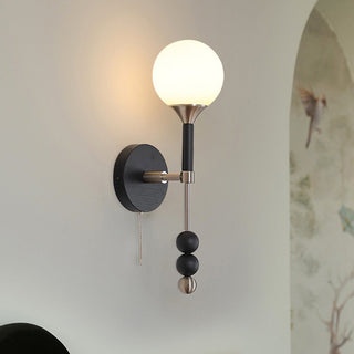 Medieval long wooden wall lamp illuminated — rustic walnut sconce