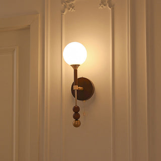 Walnut wooden medieval wall sconce close-up — rustic long lamp