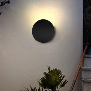 Modern aluminum disc LED wall lamp angle — soft diffused sconce