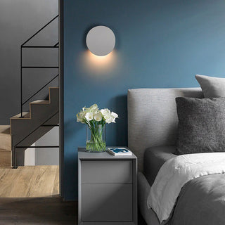 Aluminum disc LED wall lamp close-up — modern soft diffused