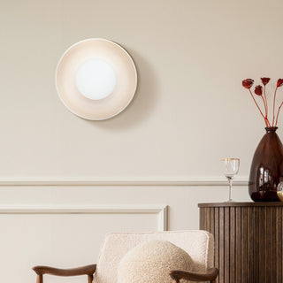 White ceramic wall lamp close-up — minimalist modern living