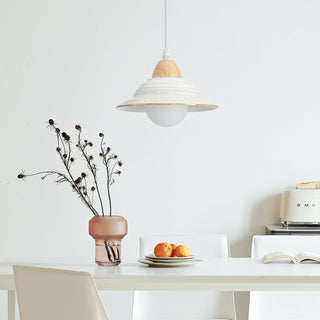 White ceramic hat pendant hanging in modern interior