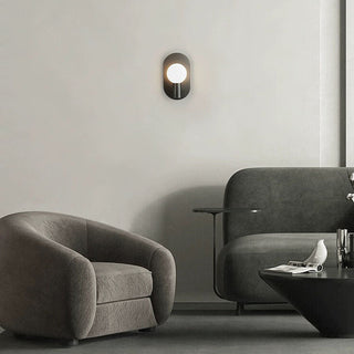 Brass Scandinavian bedside sconce close-up — warm finish lamp