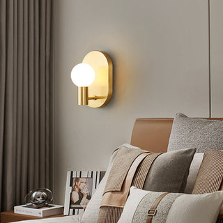 Scandinavian bedside brass wall lamp angle — warm finish sconce
