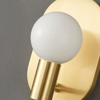 Scandinavian brass wall lamp bedside illuminated — warm finish