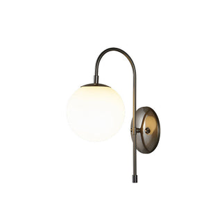 Vintage copper wall lamp in hallway — ball shaped brass glass