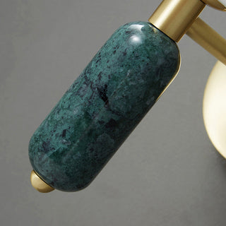 Cylindrical copper marble bedside wall sconce close-up — lamp