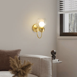 Mid-century glass brass wall sconce detail — rotatable lamp