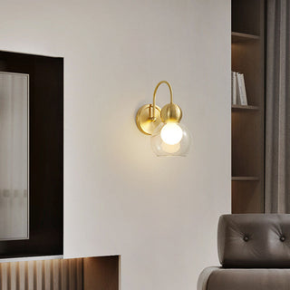 Rotatable mid-century brass wall light — glass sconce fixture