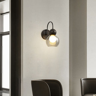 Mid-century rotatable wall sconce close-up — brass glass lamp