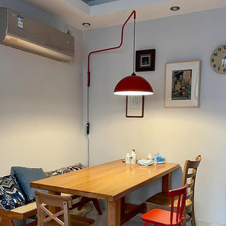 Modern geometric red wall lamp in living room — creative shade
