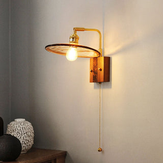 Brown glass brass wall sconce ambient — mid-century retro