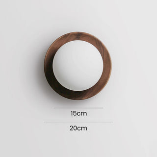 Round natural wood minimalist wall lamp close-up — sconce