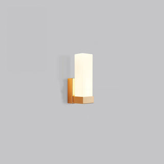 Prismatic metal LED wall lamp illuminated — warm finish sconce