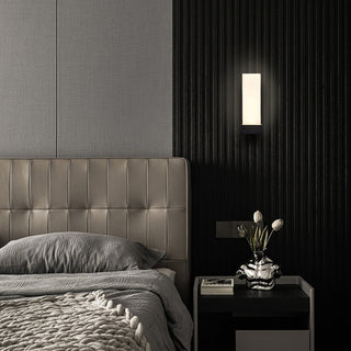 Prismatic metal wall sconce in living room — minimalist LED lamp