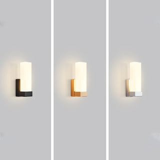 Metal prismatic LED wall sconce close-up — minimalist warm light