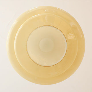 Three-layer yellow glass pendant top view — Bauhaus dining ceiling