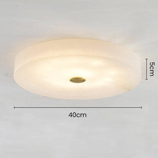 White marble ceiling fixture from below, elegant flush mount