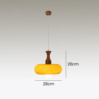 Medieval walnut pendant showing wood grain and glass
