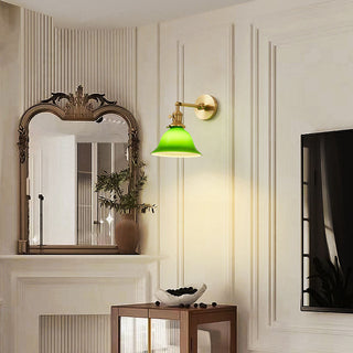 Mid-century adjustable brass wall lamp green glass shade — dining
