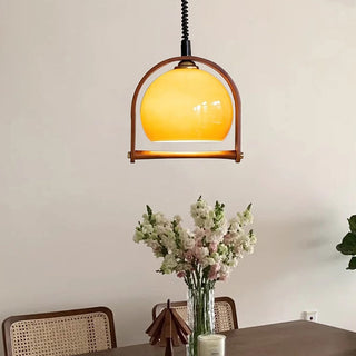 Mid-century glass ball close-up — orange pendant dining lamp