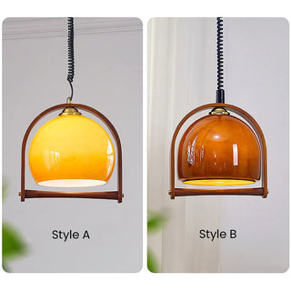 Mid-century orange ball pendant styled — dining room fixture