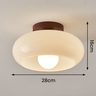 Small white vintage ceiling fixture illuminated, hallway