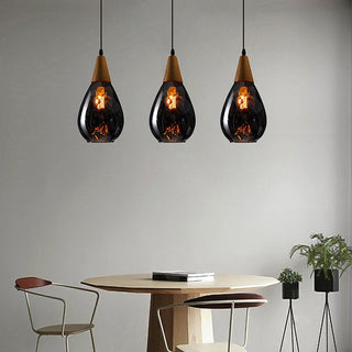 Teardrop amber pendant in interior — vintage glass dining lamp