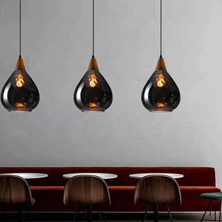 Amber clear glass teardrop pendant detail — vintage hanging fixture