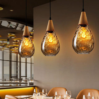 Teardrop glass pendant close-up — amber clear vintage hanging lamp