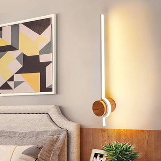 Wood LED linear bathroom vanity wall lamp illuminated — warm
