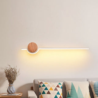 Linear wood bathroom vanity LED wall sconce detail — warm