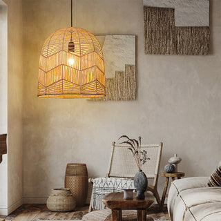 Rattan pendant casting woven shadow pattern on walls
