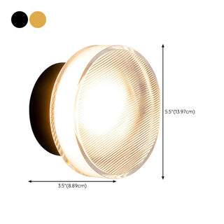 Modern acrylic LED wall lamp in bedroom — sleek sconce