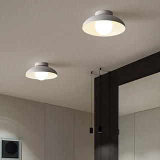Metal semi-flush ceiling fixture illuminated, contemporary hallway