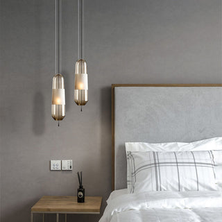 Capsule glass pendant hanging in modern interior — adjustable lamp