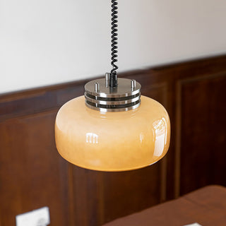 Coffee brown glass pendant in interior — modern hanging lamp