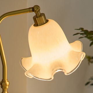 Floral brass lamp setting — vintage flower shade wide view
