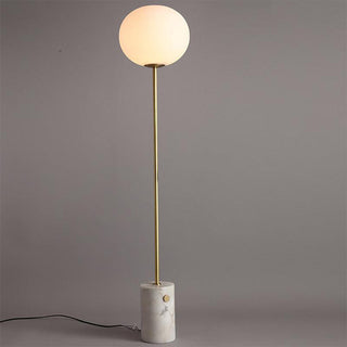 Globe glass marble lamp close-up — brass iron frame detail
