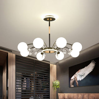 Gold glass raindrop chandelier illuminated — luxury warm ceiling