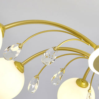Gold raindrop glass chandelier detail — luxury warm texture