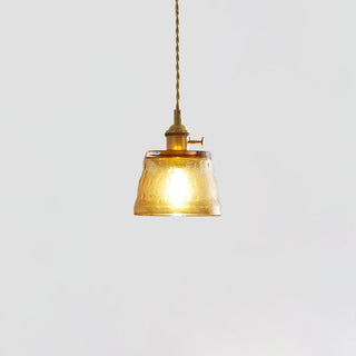 Contemporary glass cup pendant over kitchen counter