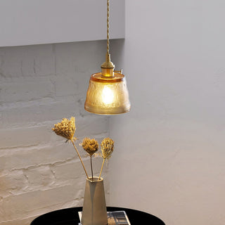 Glass cup pendant lamp showing smooth curved shade