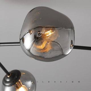 Modern lava glass chandelier detail — brass molecular warm