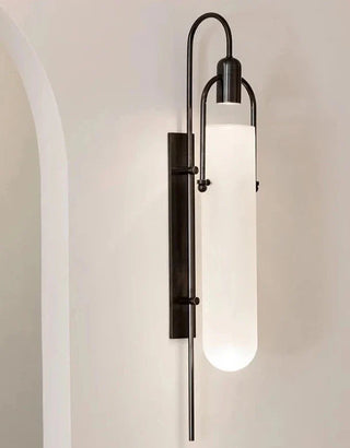 Cylindrical black metal wall sconce — contemporary LED floating fixture