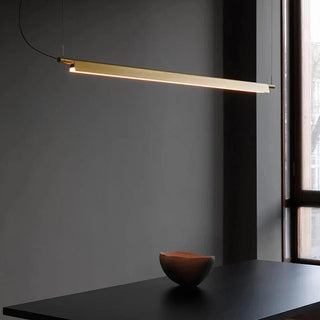 Linear aluminium pendant over dining area — Scandinavian hanging lamp