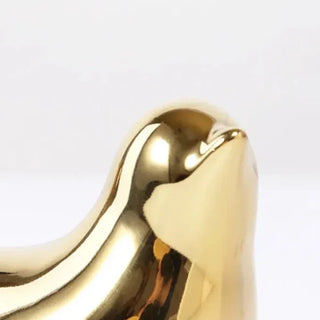 golden bird figure handmade enamel ceramic bird sculpture elegant home decor close-up
