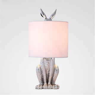 Resin rabbit lamp detail — masked white fabric shade