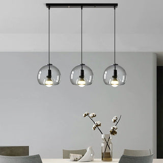 Contemporary pendant with handblown amber glass orb